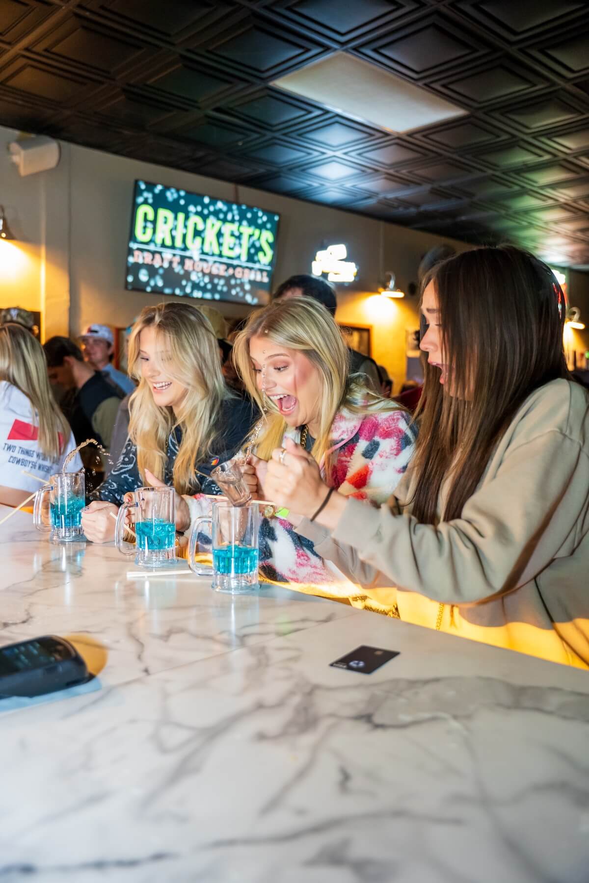 Girls sitting at bar