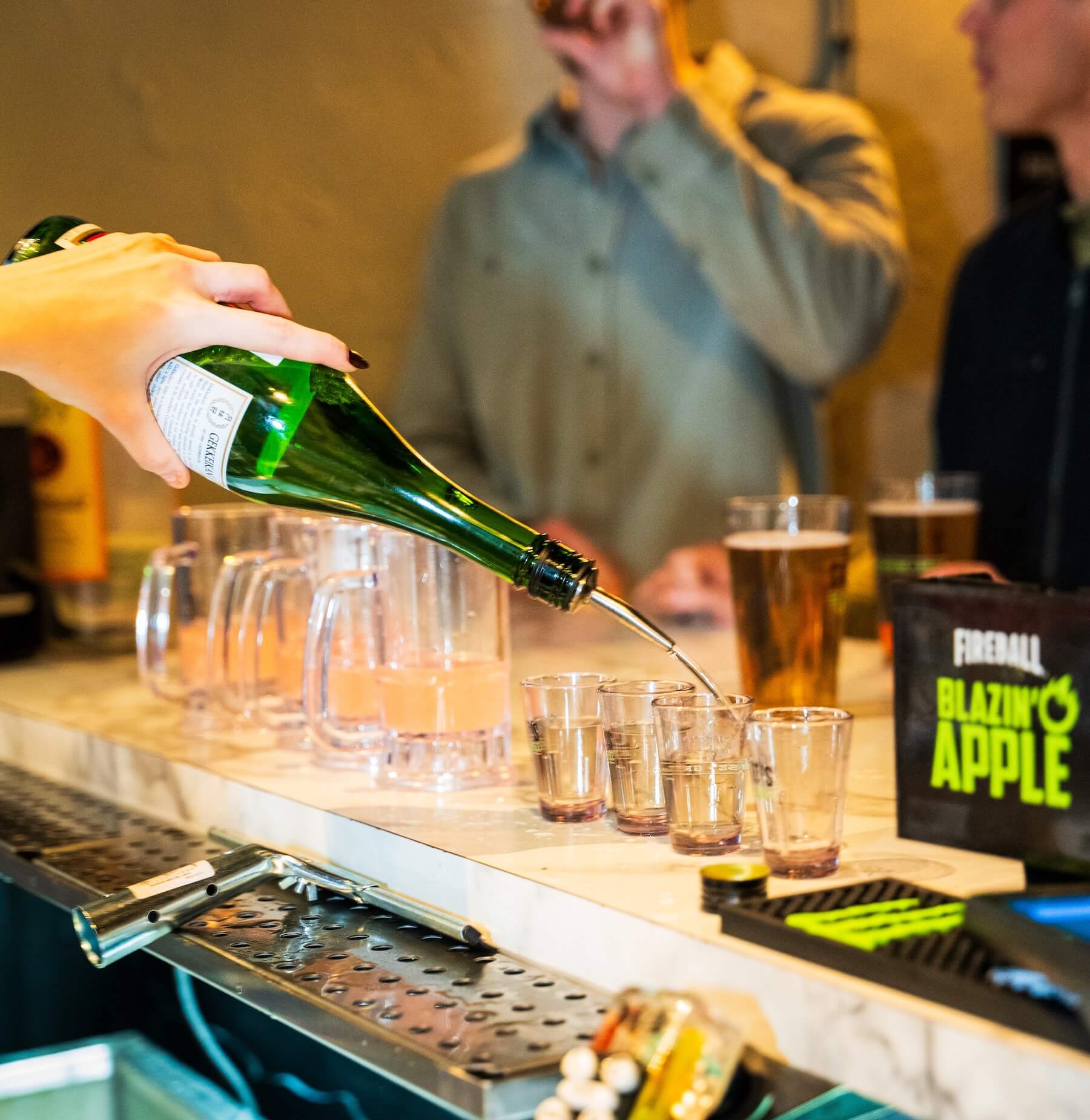 Bartender pouring drinks