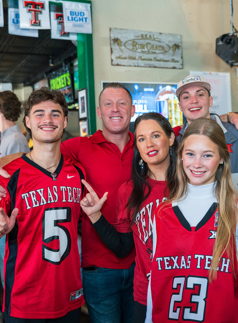 Group of people supporting their favorite college team